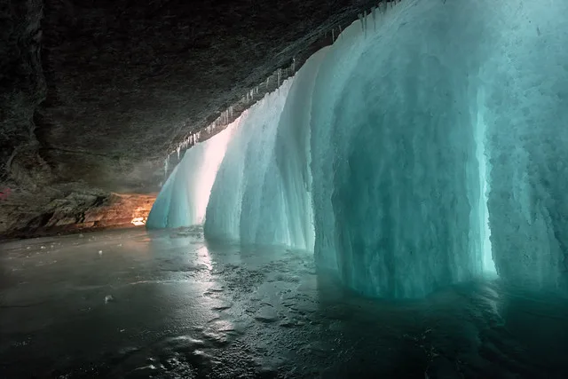 Behind the falls. Minnehaha Falls frozen in winter, Minneapolis, Minnesota, Minnehaha Falls in Minneapolis, Minnesota